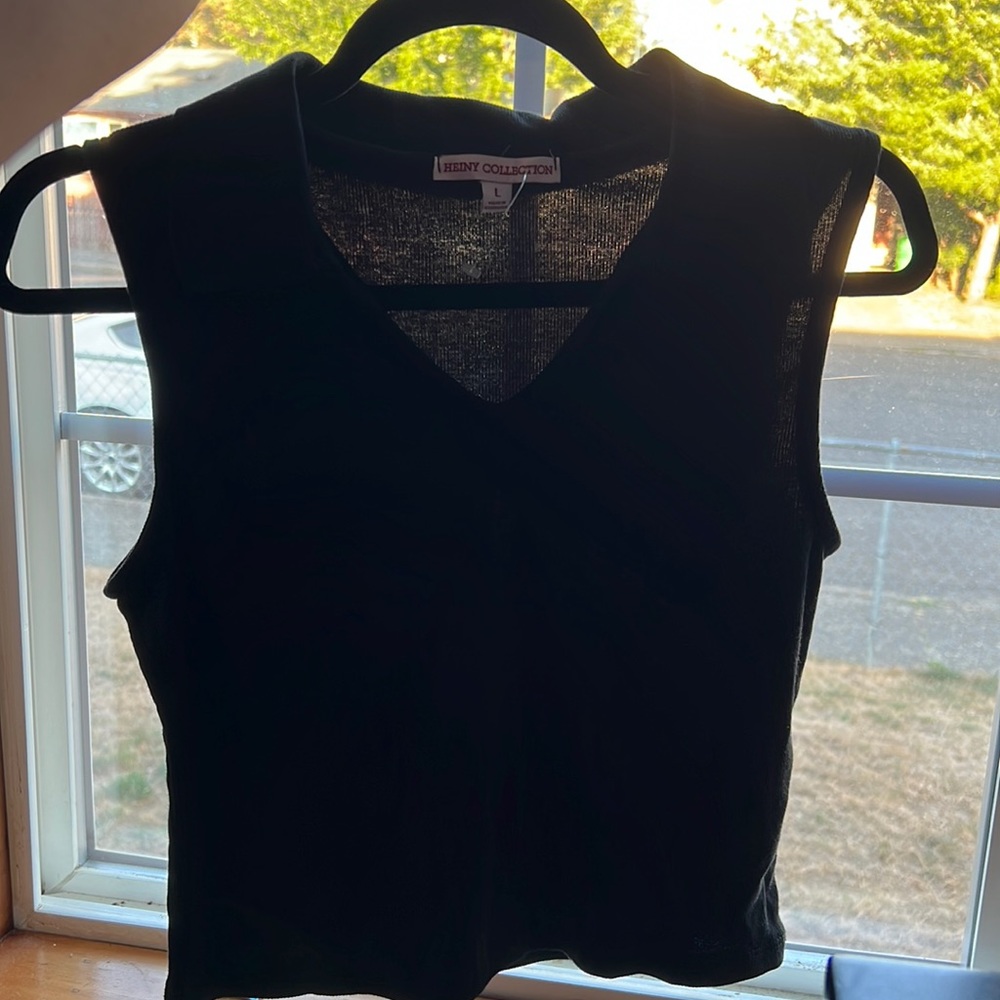 Black sleeveless top with a v-neck and collar perfect basic. Size L
